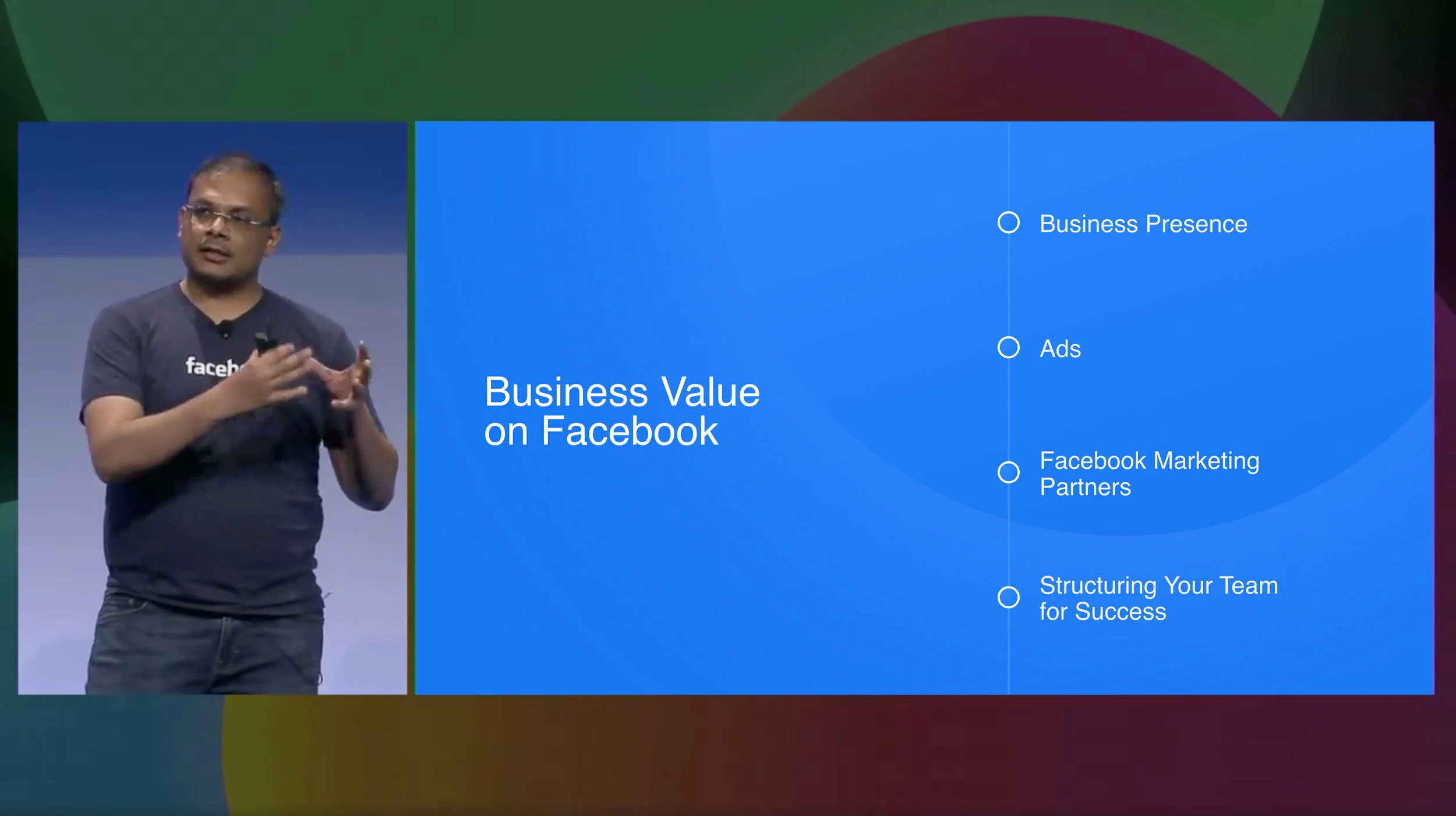 The VP presenting the Business Value on Facebook slide on stage